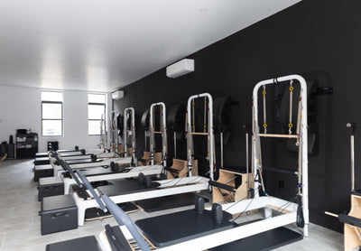 Selecting the Best Pilates Class: A Guide to Mat, Reformer, Tower, and Chair Workouts